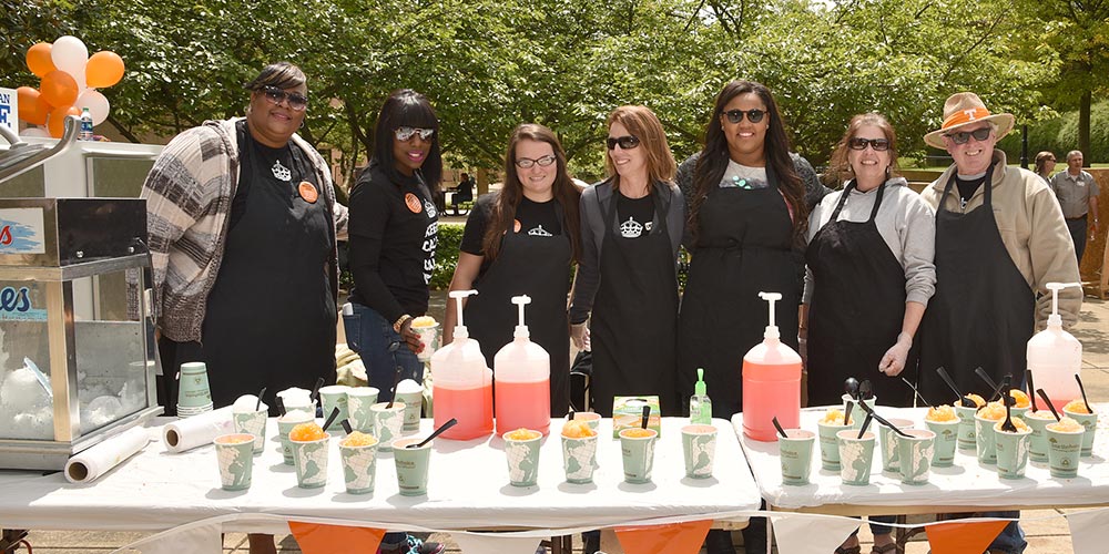 Employees at the picnic with snowcones