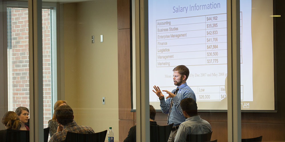 Person speaking to a group about salary information